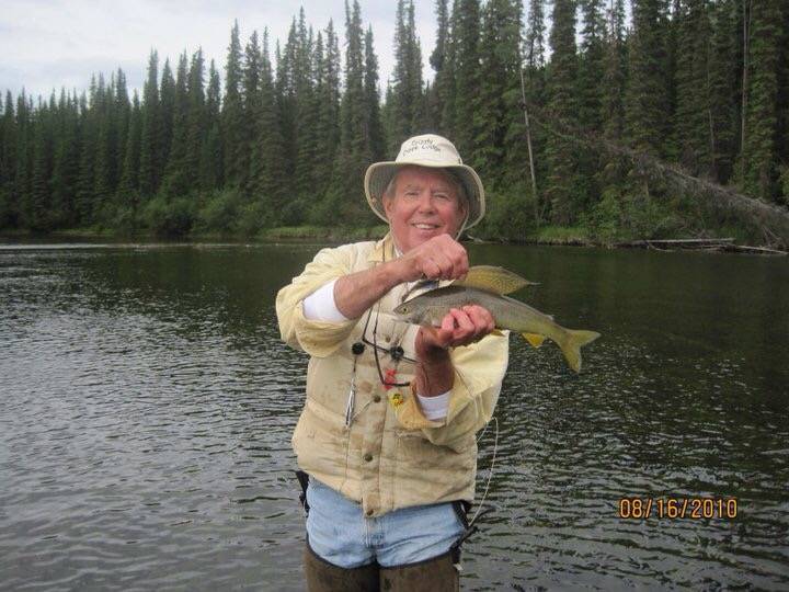 fisherman with arctic grayling